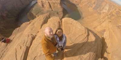 Standing at the rim of the Glen Canyon overlooking the Horseshoe Bend in Page, Arizona.